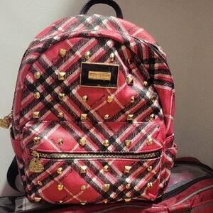 Stylish Red Plaid Backpack with Gold Accents